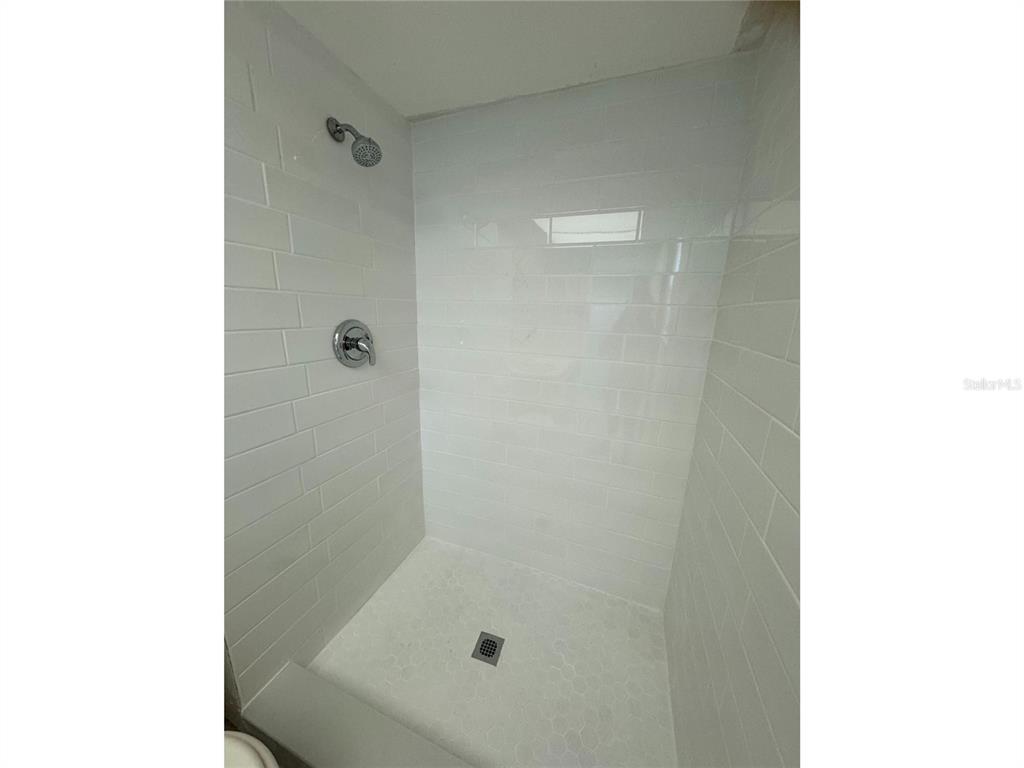 1433 South Belcher Road, Unit C1 Clearwater, FL 33764 - Photo 22 of 27 a bathroom with a bathtub