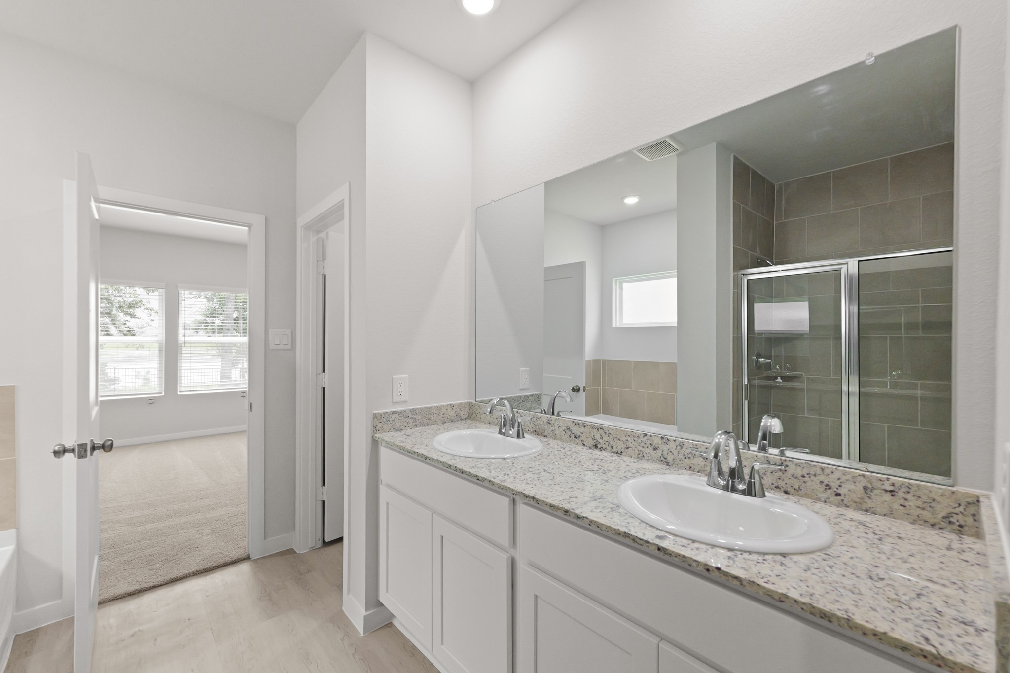 4414 Albritton Avenue Bryan, TX 77845 - Photo 28 of 34 a bathroom with a granite countertop sink and a mirror