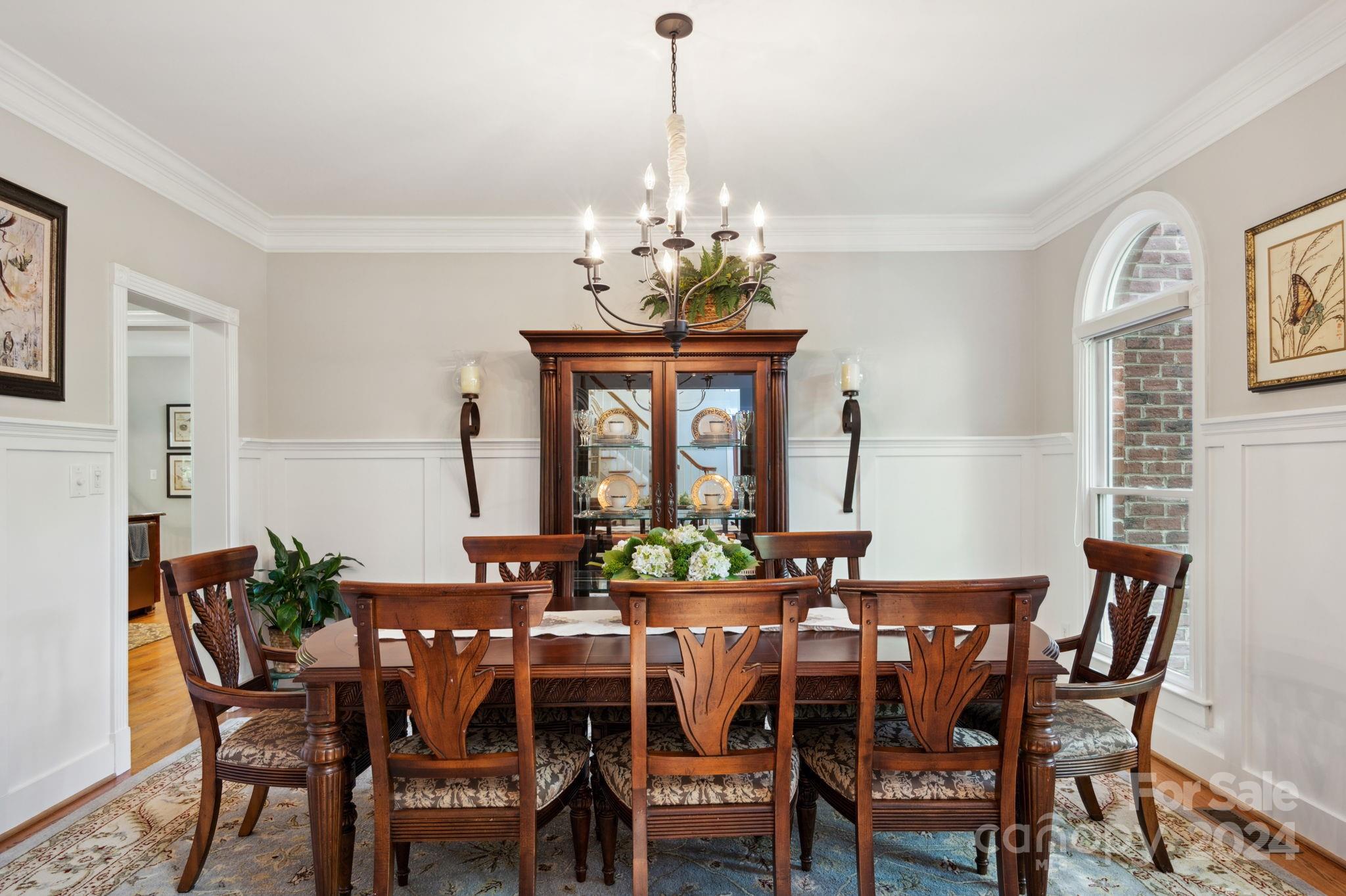 1418 Reverdy Oaks Drive Matthews, NC 28105 - Photo 5 of 45 a view of a dining room with furniture window and wooden floor