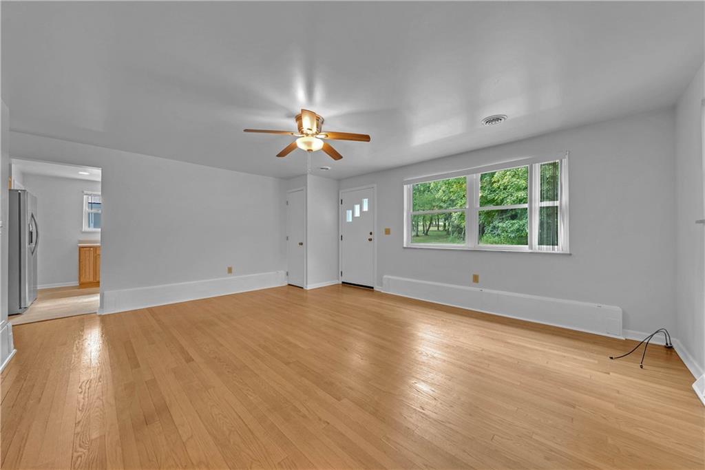 492 Center Grange Road Monaca, PA 15061 - Photo 11 of 36 wooden floor in an empty room with a window