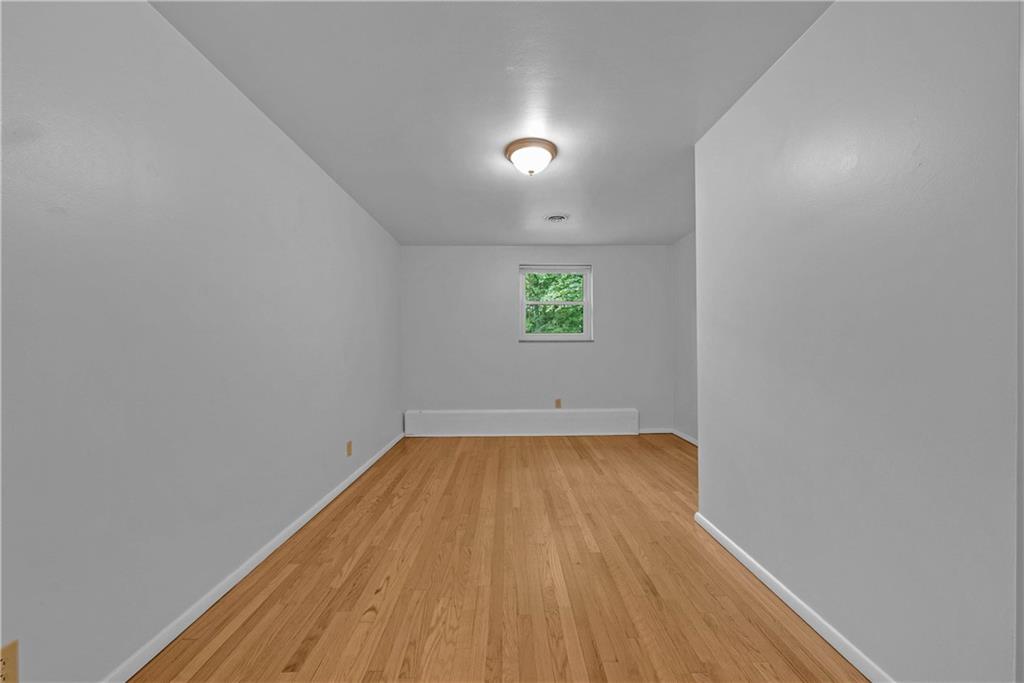 492 Center Grange Road Monaca, PA 15061 - Photo 12 of 36 a view of a room with wooden floor and window