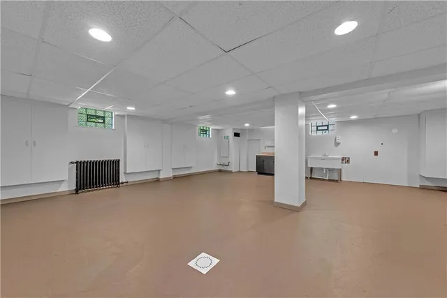 an empty room with an empty space and windows