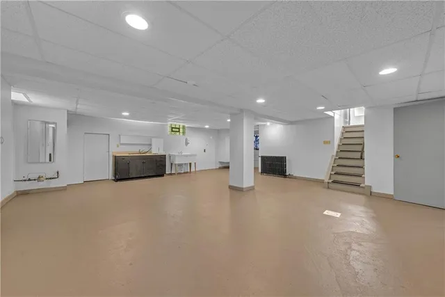 a view of an empty room with a kitchen