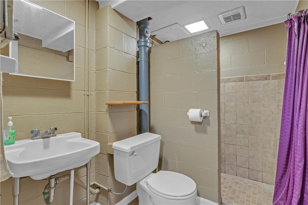 492 Center Grange Road Monaca, PA 15061 - Photo 22 of 36 a bathroom with a sink toilet and shower