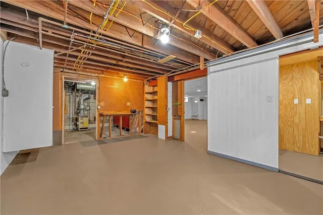 a view of a hallway with wooden shelves