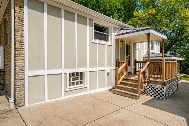 a view of a white house with large windows