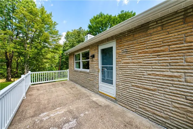a view of a house with a fence