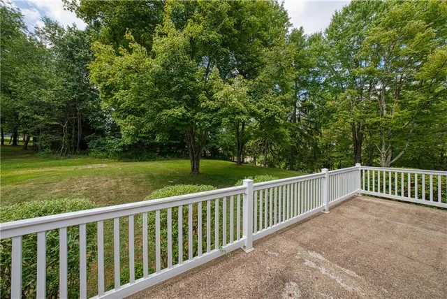 a view of a deck with a yard