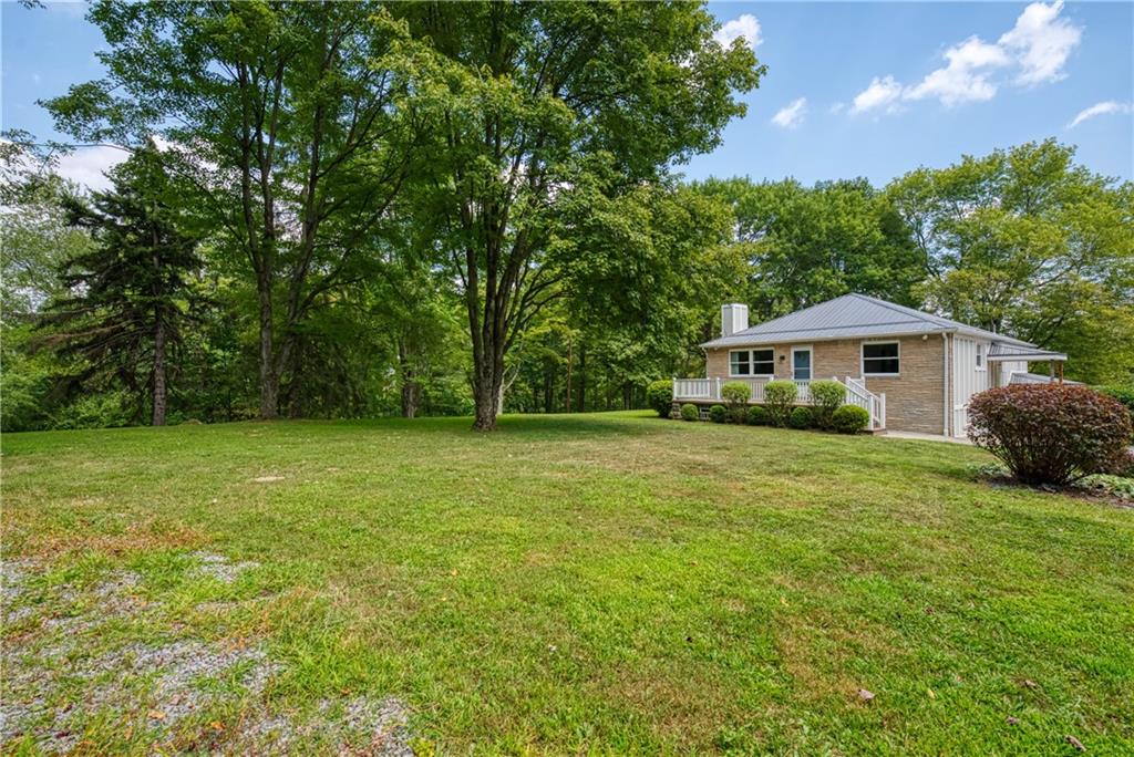 492 Center Grange Road Monaca, PA 15061 - Photo 4 of 36 a front view of a house with a yard