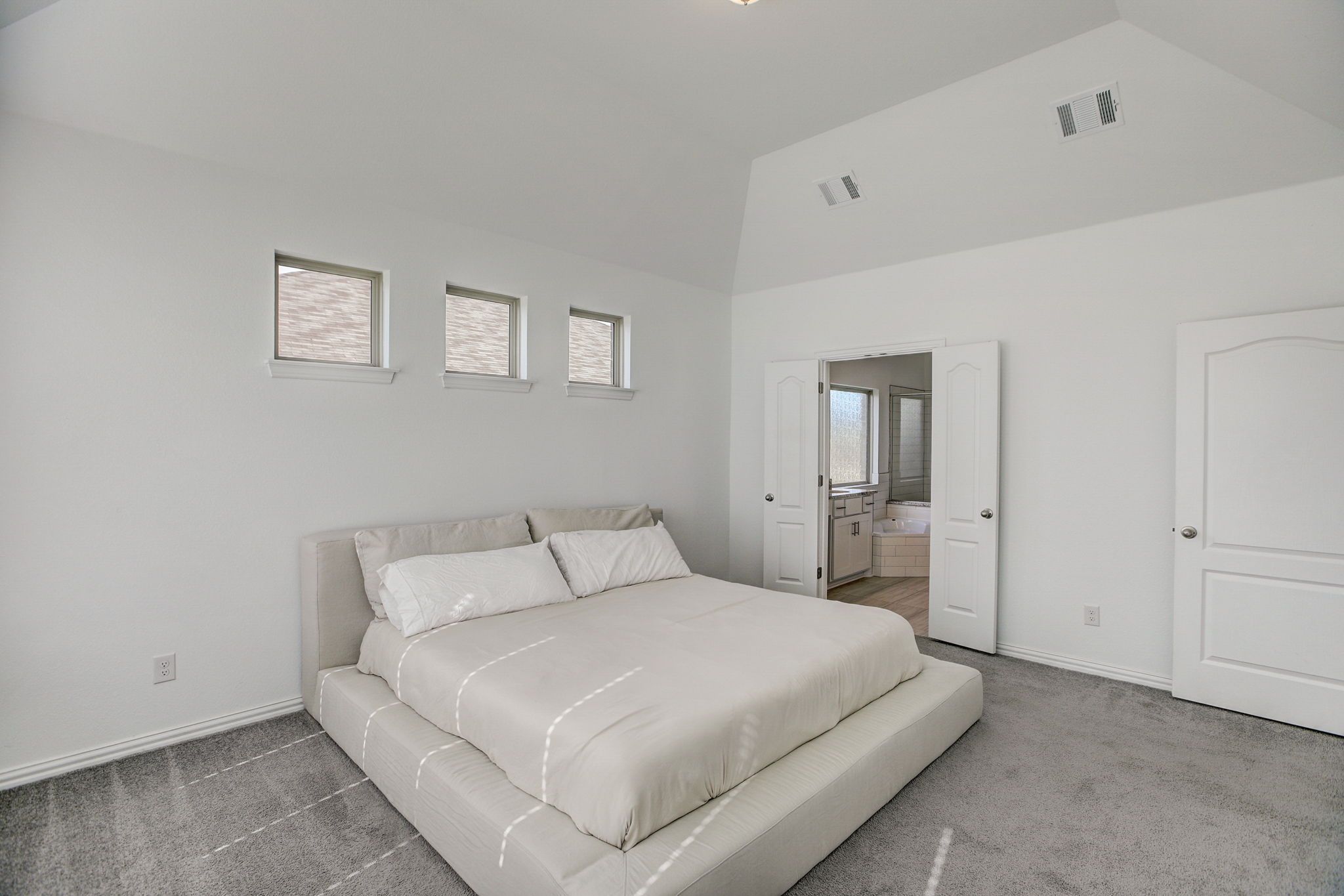 308 Monteforte Road Hutto, TX 78634 - Photo 14 of 32 a bedroom with a bed and a night stand
