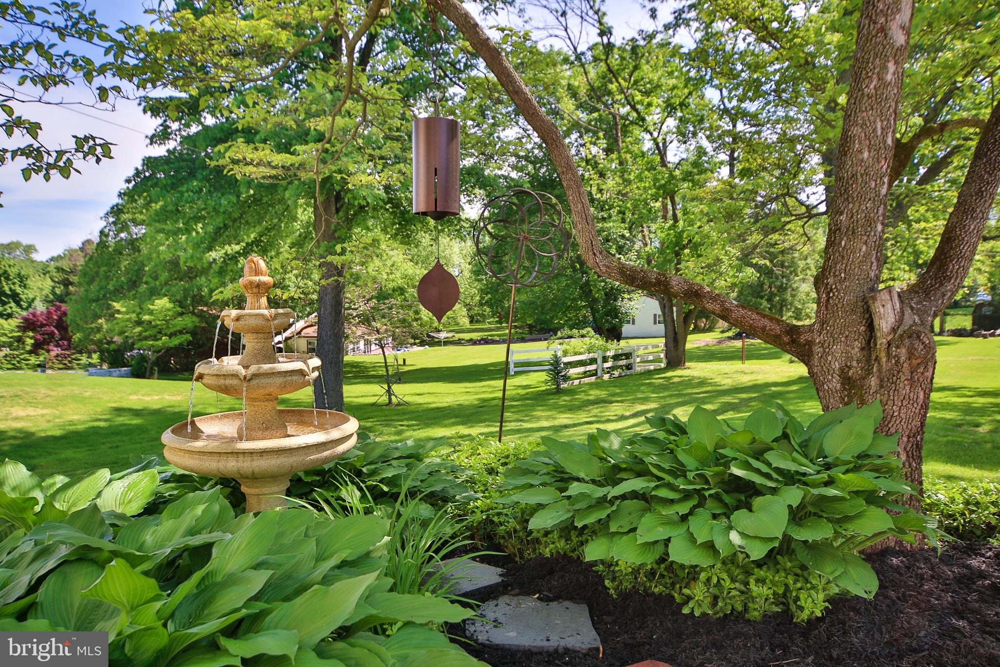 51 Mallard Road Holland, PA 18966 - Photo 17 of 20 Patio with Fountain Under a Dogwood Tree