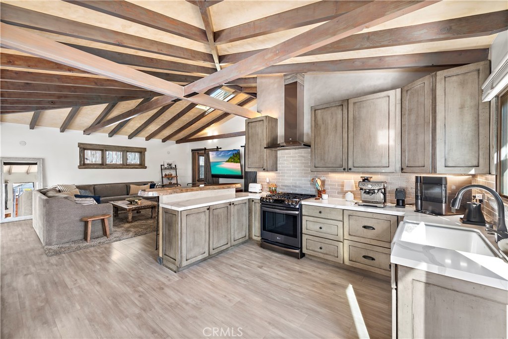 1209 C. Toledo San Clemente, CA 92672 - Photo 12 of 55 a kitchen that has a lot of cabinets in it