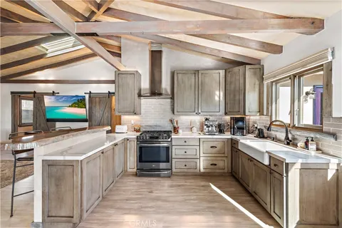 a kitchen with a stove a refrigerator and a stove