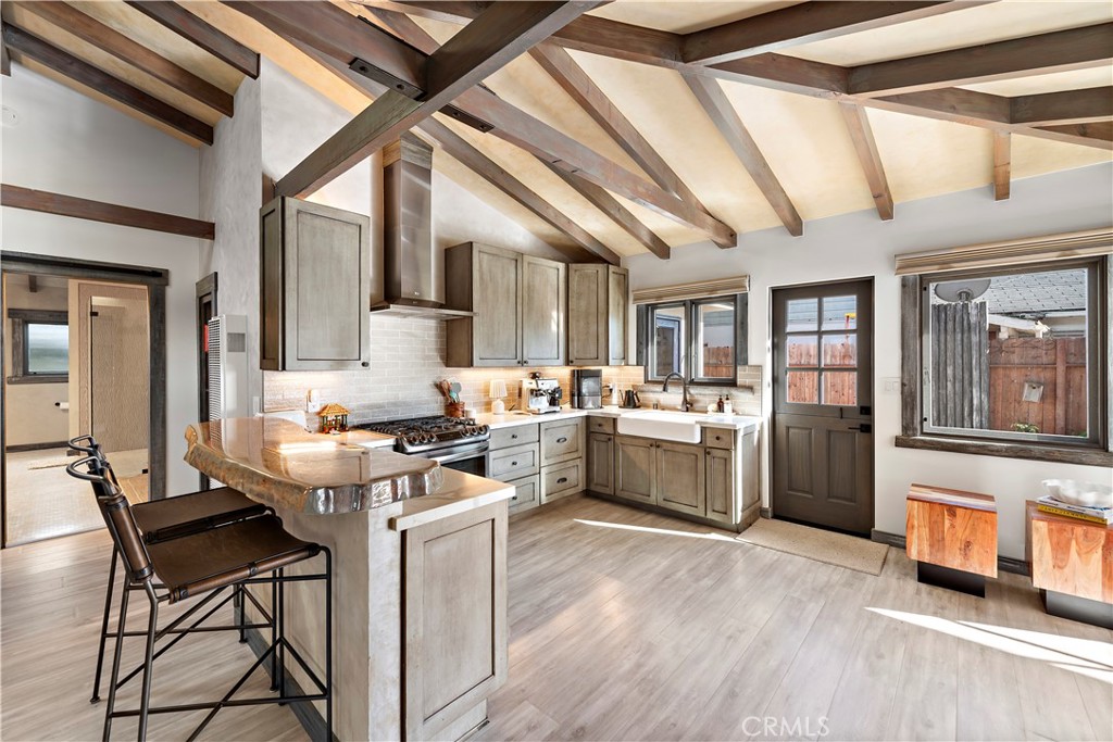 1209 C. Toledo San Clemente, CA 92672 - Photo 14 of 55 a kitchen with a stove a refrigerator and a stove