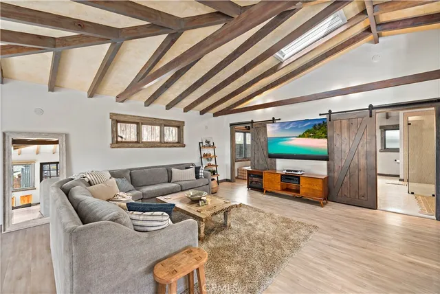 a living room with furniture and a table