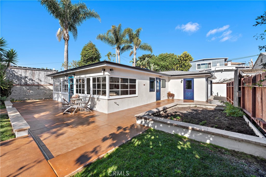1209 C. Toledo San Clemente, CA 92672 - Photo 2 of 55 a front view of a house with a garden