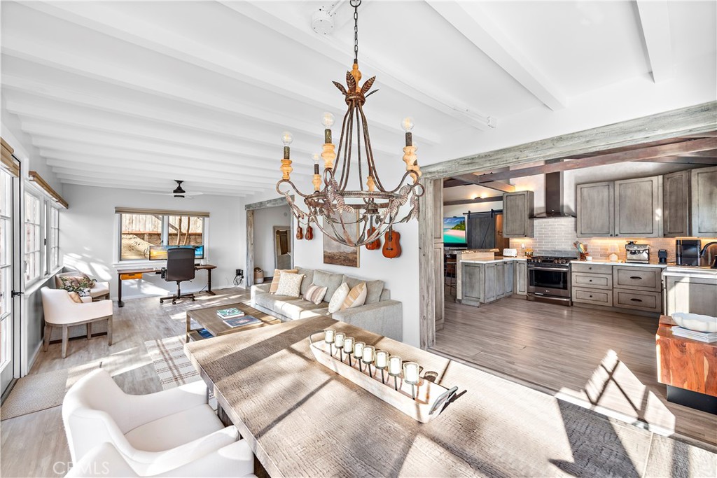 1209 C. Toledo San Clemente, CA 92672 - Photo 25 of 55 a living room with furniture and a chandelier