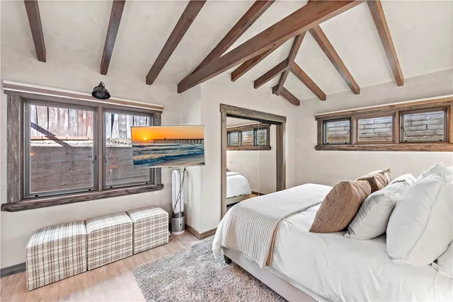 a kitchen with refrigerator and cabinets