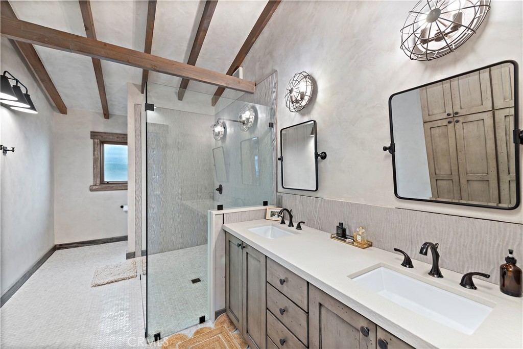 1209 C. Toledo San Clemente, CA 92672 - Photo 31 of 55 a bathroom with a double vanity sink mirror and