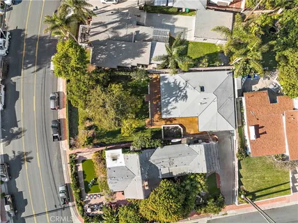 an aerial view of residential house with outdoor space and parking