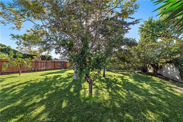 a front view of a house with a yard table and chairs