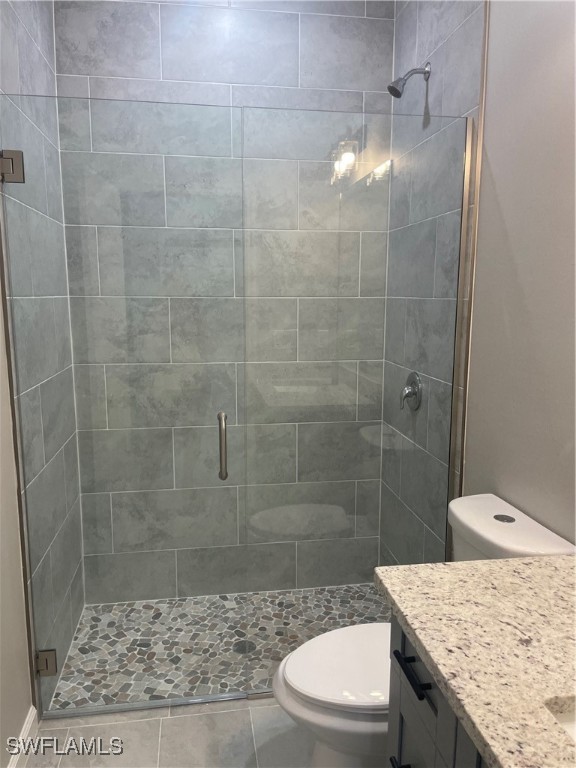3961-3963 Sunset Road Lehigh Acres, FL 33971 - Photo 12 of 18 a bathroom with a granite countertop sink a toilet and shower