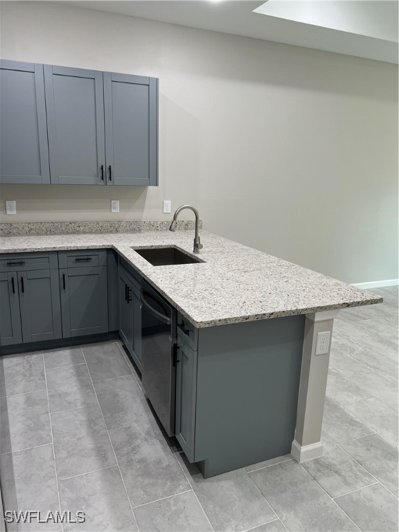 3961-3963 Sunset Road Lehigh Acres, FL 33971 - Photo 5 of 18 a kitchen with a sink cabinets and wooden floor