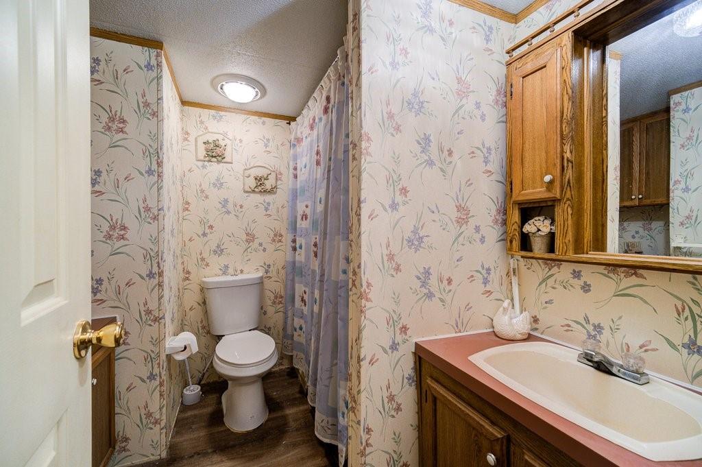 152 Old Tacy Road, Unit 95 Bethel, NY 12720 - Photo 14 of 16 a bathroom with a sink toilet and shower