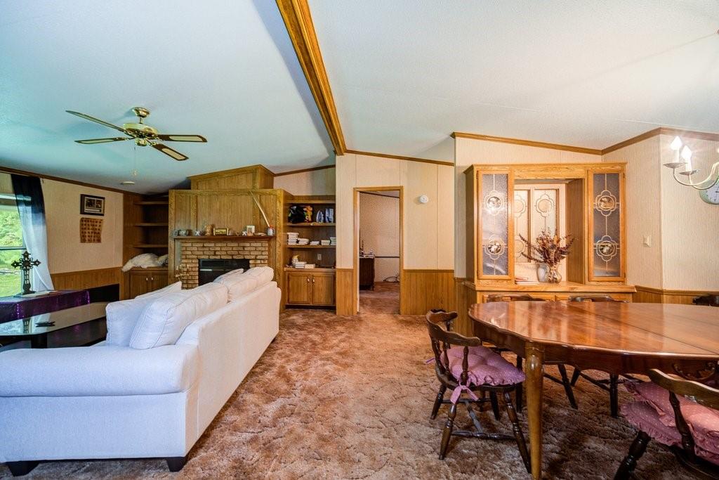 152 Old Tacy Road, Unit 95 Bethel, NY 12720 - Photo 6 of 16 a living room with furniture and a large window