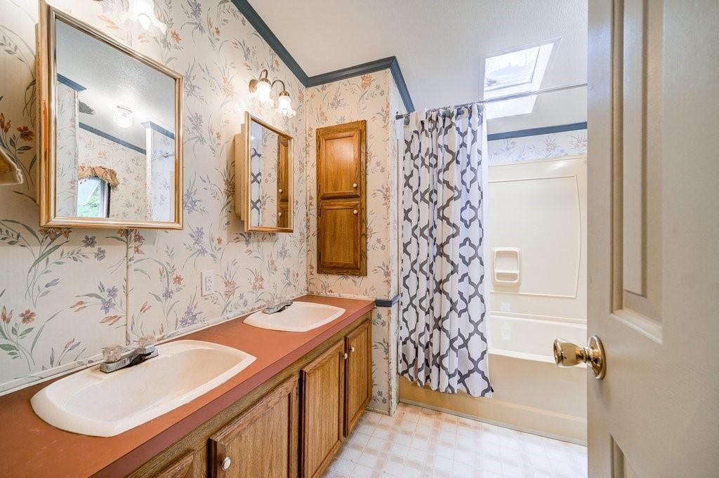 152 Old Tacy Road, Unit 95 Bethel, NY 12720 - Photo 10 of 16 a bathroom with a sink and a mirror