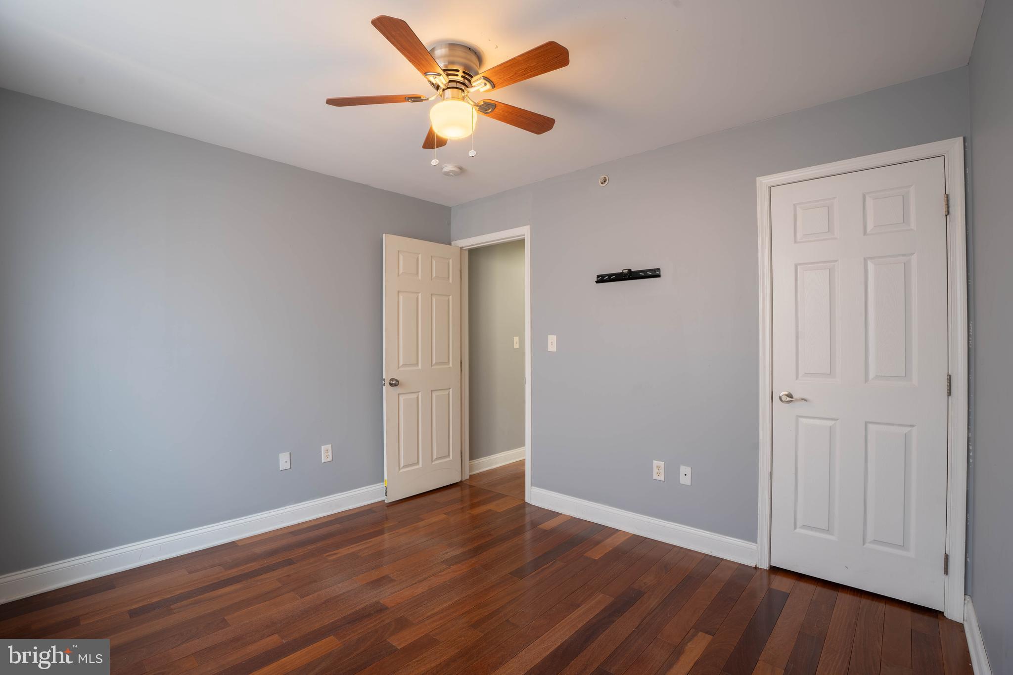 2212 North 16th Street, Unit 2 Philadelphia, PA 19132 - Photo 11 of 18 a view of an empty room with wooden floor