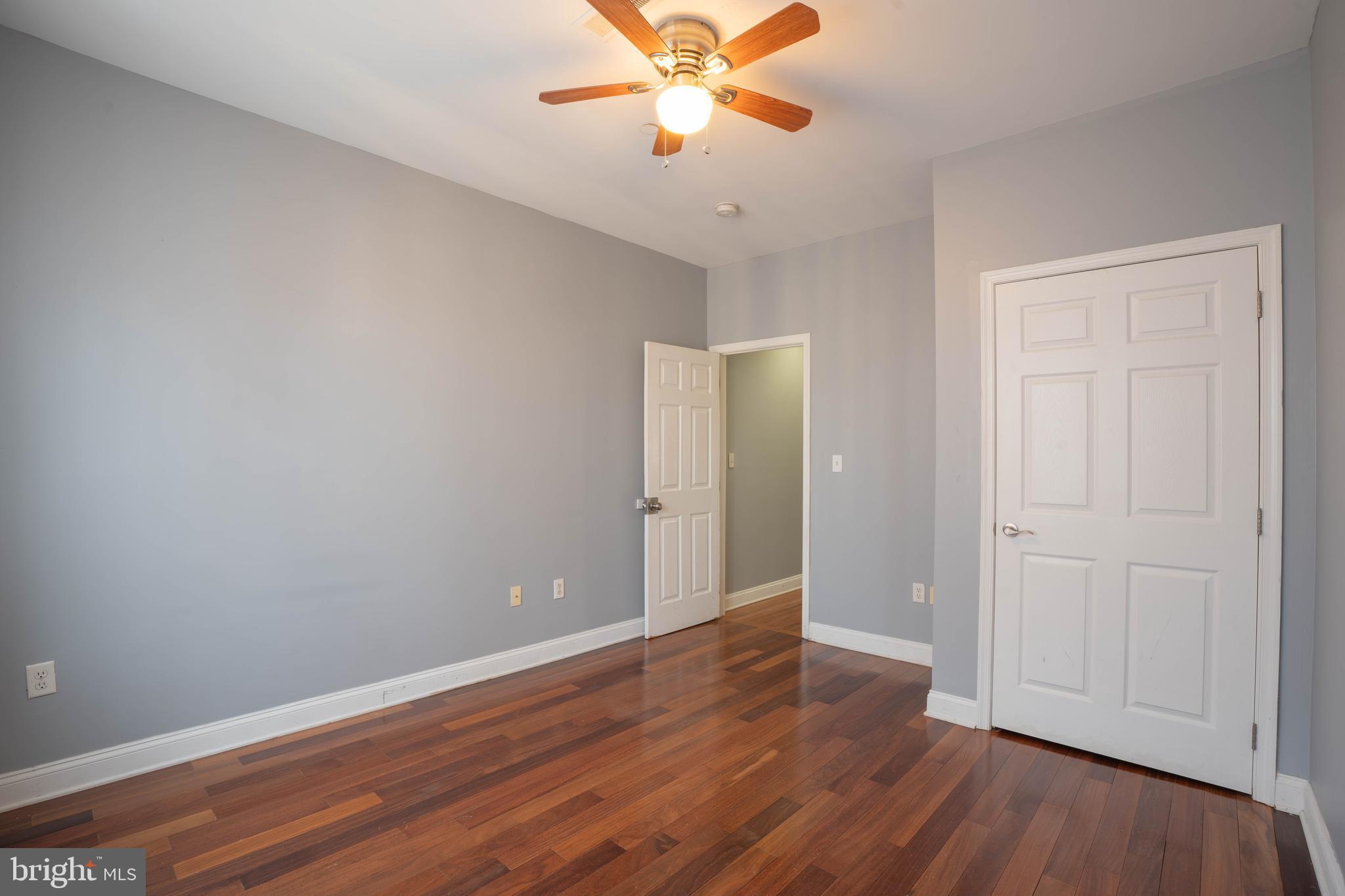 2212 North 16th Street, Unit 2 Philadelphia, PA 19132 - Photo 7 of 18 a view of an empty room with wooden floor