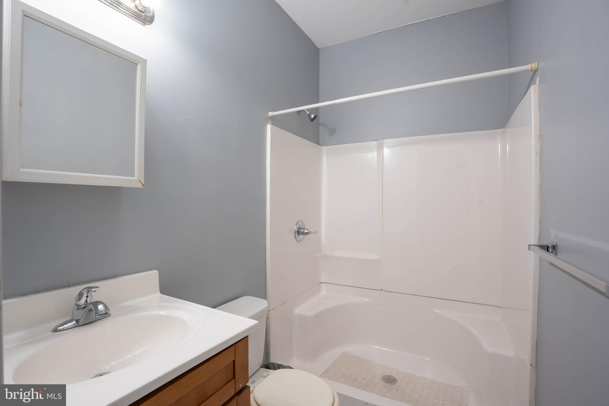 2212 North 16th Street, Unit 2 Philadelphia, PA 19132 - Photo 9 of 18 a bathroom with a sink toilet and shower