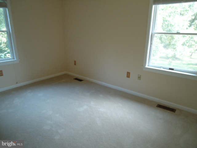 6838 Warfield Road Gaithersburg, MD 20882 - Photo 17 of 17 an empty room with a window