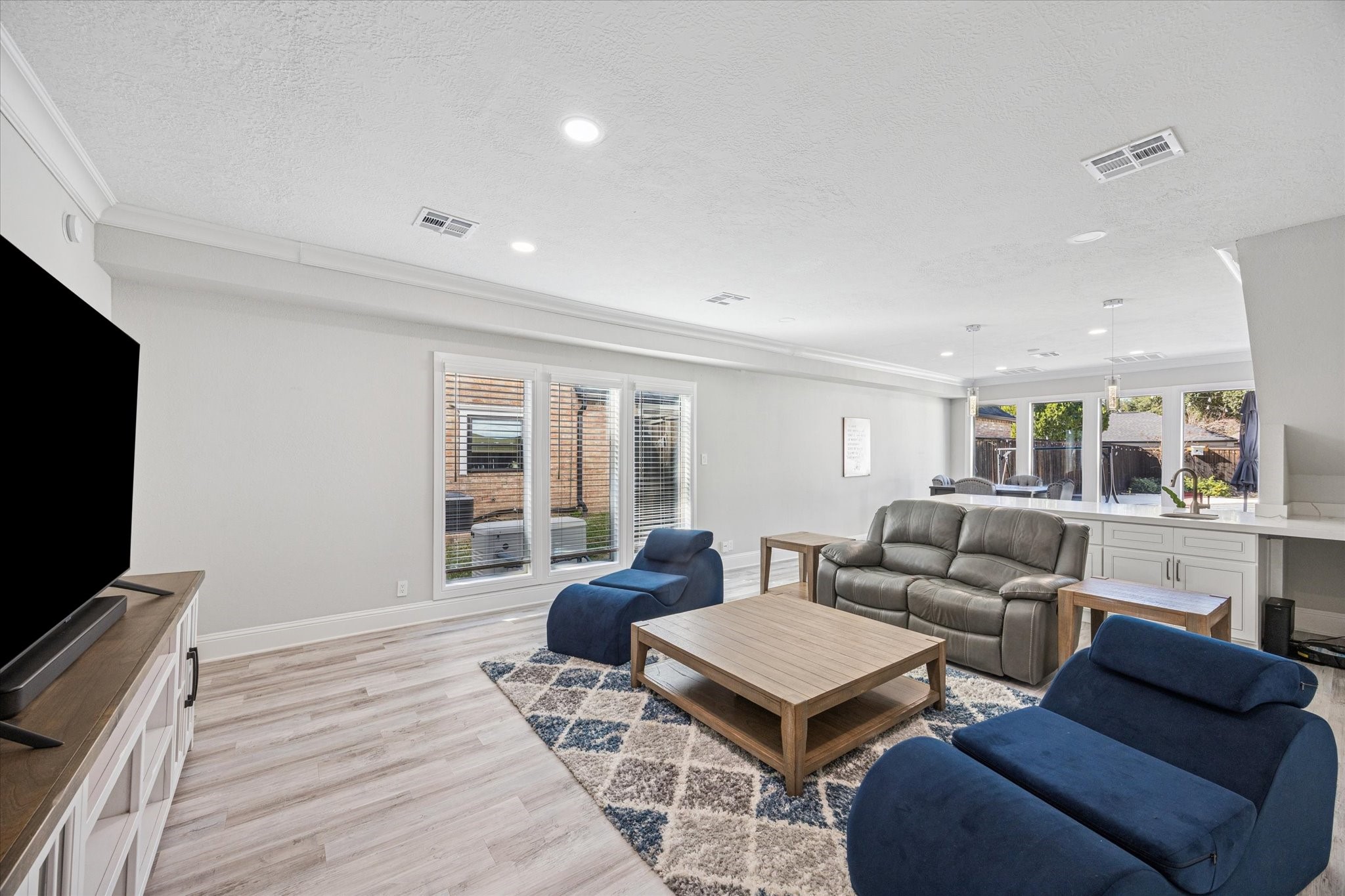 830 Silvergate Drive Houston, TX 77079 - Photo 13 of 38 a living room with furniture and a flat screen tv