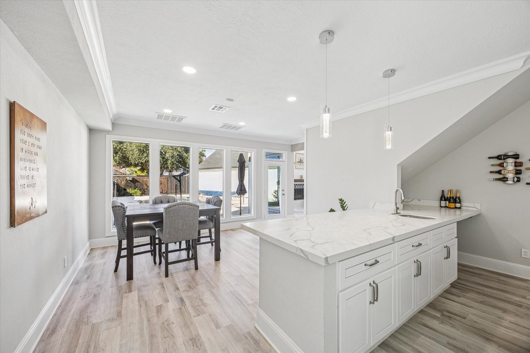 830 Silvergate Drive Houston, TX 77079 - Photo 17 of 38 a living room with stainless steel appliances kitchen island granite countertop furniture and wooden floors