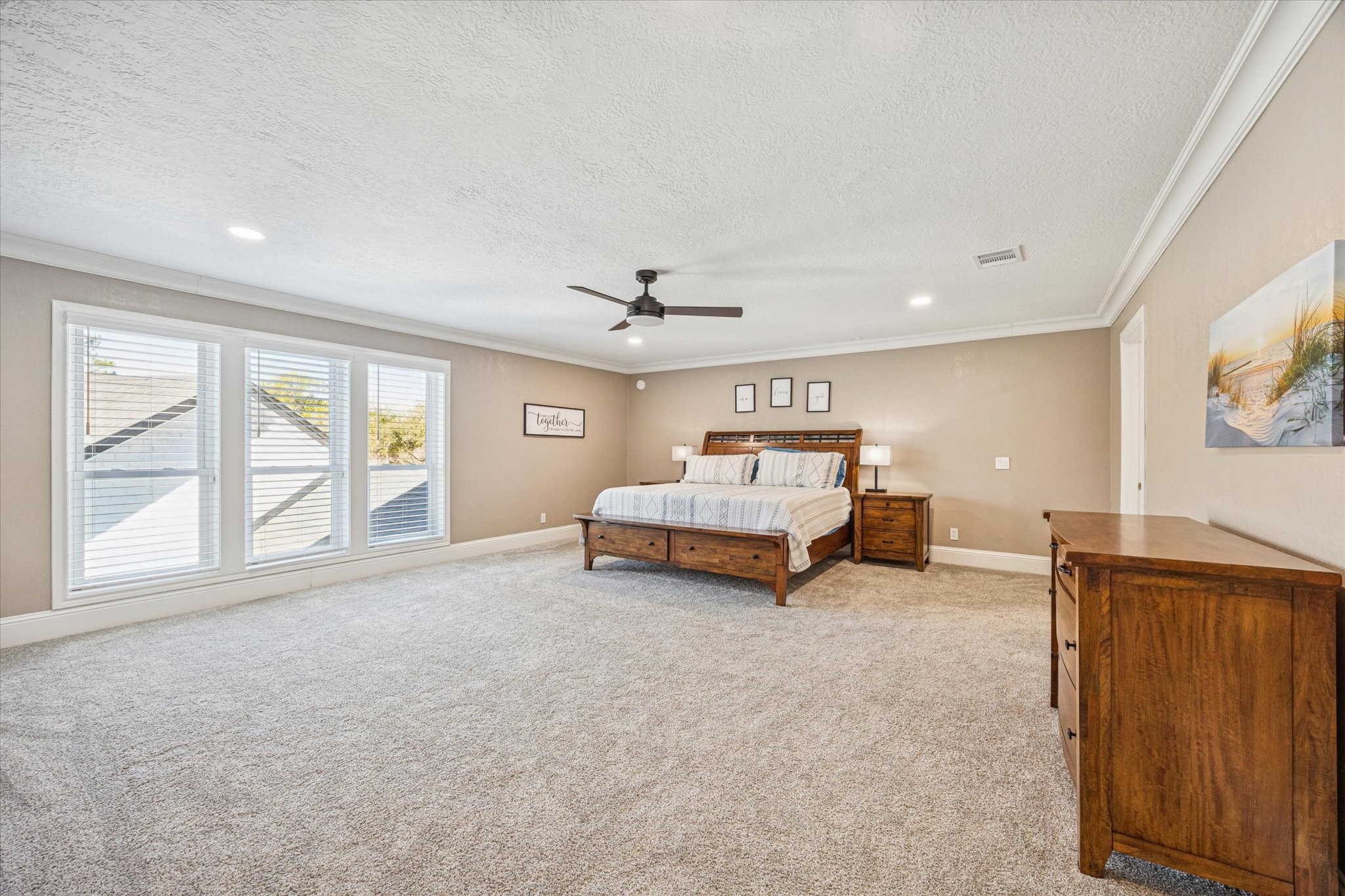 830 Silvergate Drive Houston, TX 77079 - Photo 19 of 38 a spacious bedroom with a bed and large windows