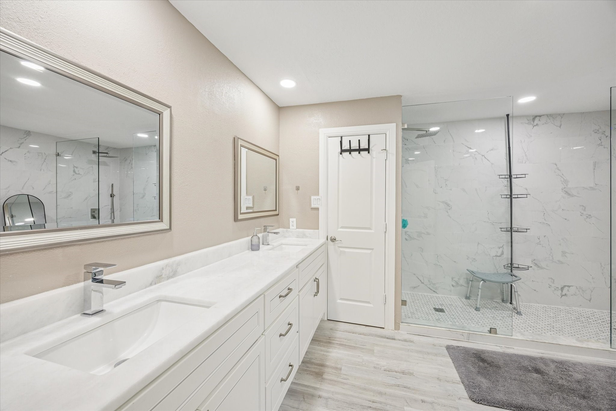 830 Silvergate Drive Houston, TX 77079 - Photo 21 of 38 a bathroom with a double vanity sink mirror double shower and a mirror