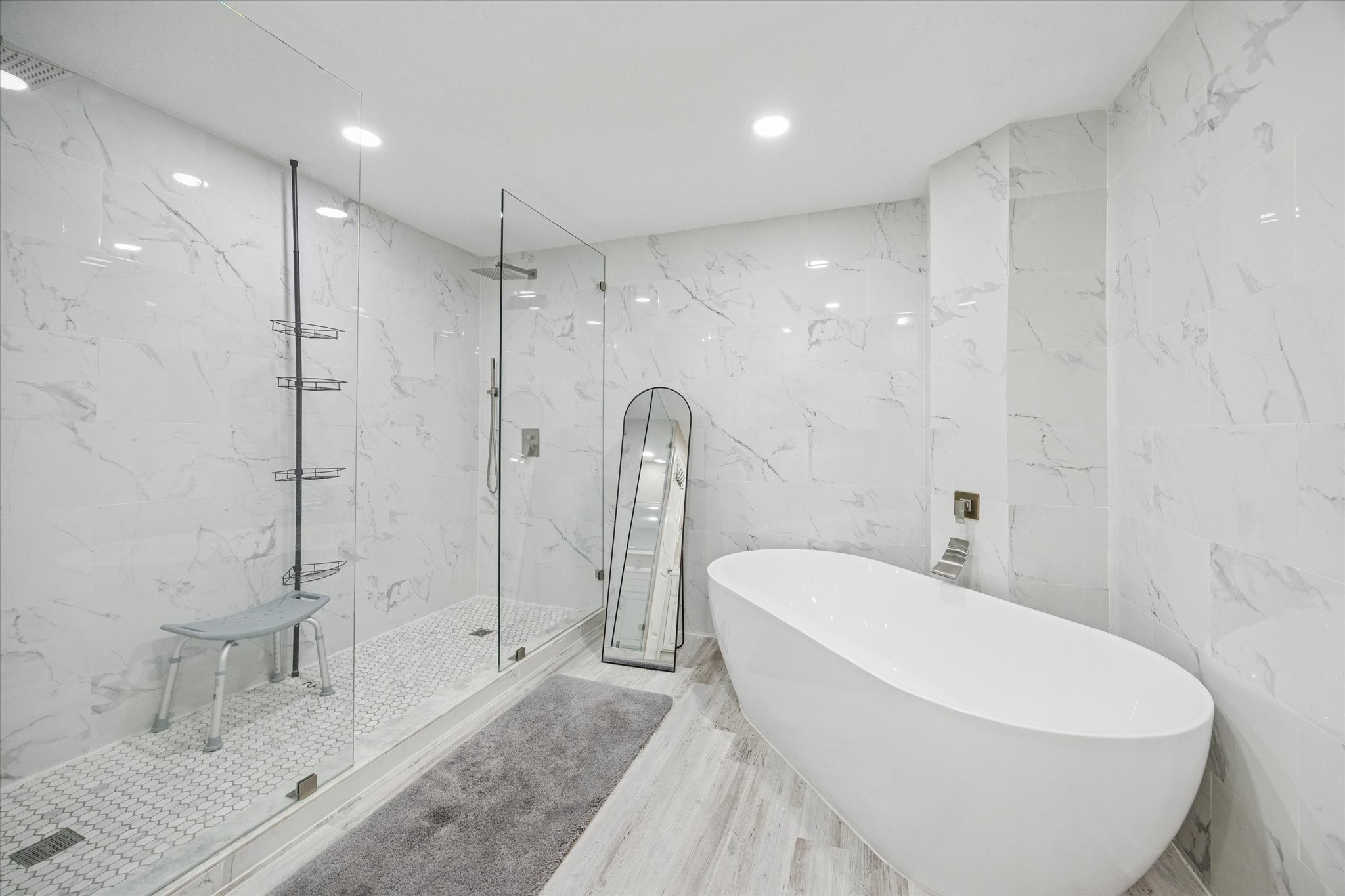 830 Silvergate Drive Houston, TX 77079 - Photo 22 of 38 a white bath tub sitting next to a bathroom shower