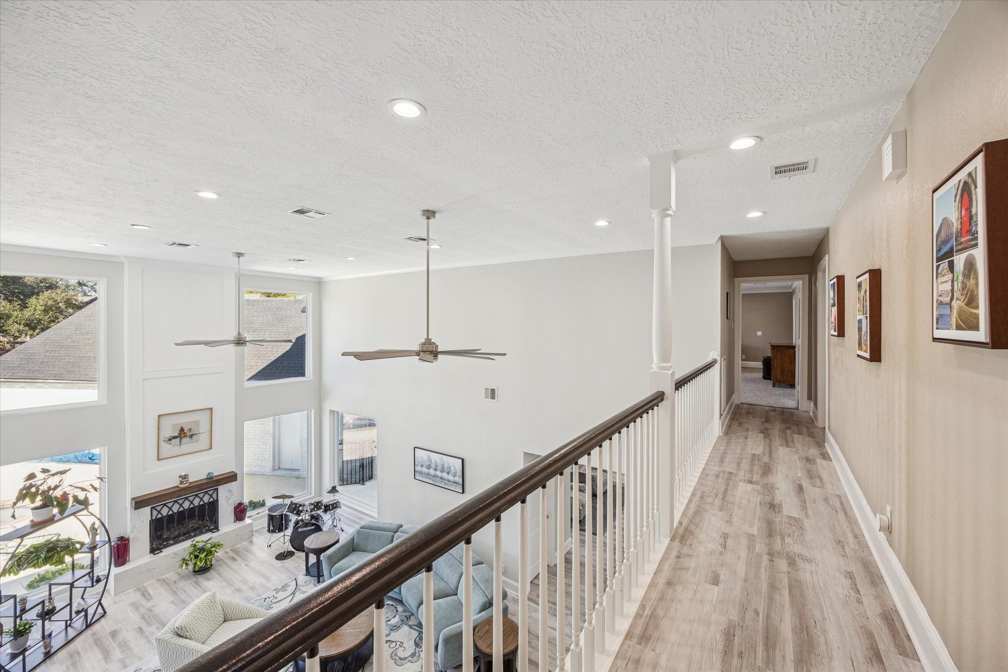 830 Silvergate Drive Houston, TX 77079 - Photo 23 of 38 a view of hallway with furniture and wooden floor