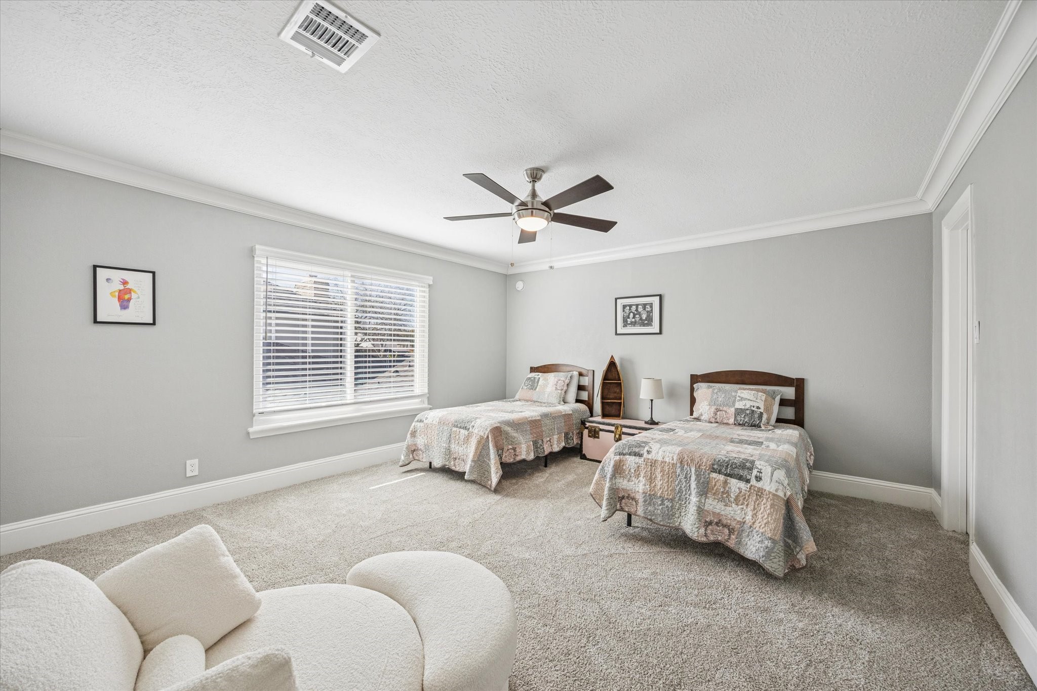 830 Silvergate Drive Houston, TX 77079 - Photo 24 of 38 a spacious bedroom with a bed and a couch