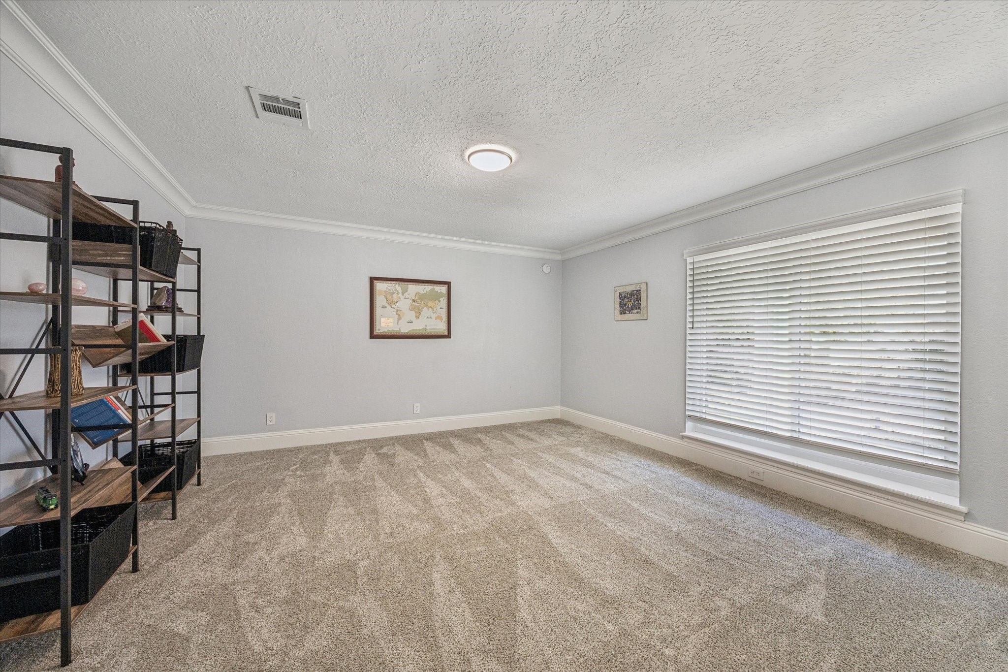830 Silvergate Drive Houston, TX 77079 - Photo 27 of 38 a view of an empty room with shelves