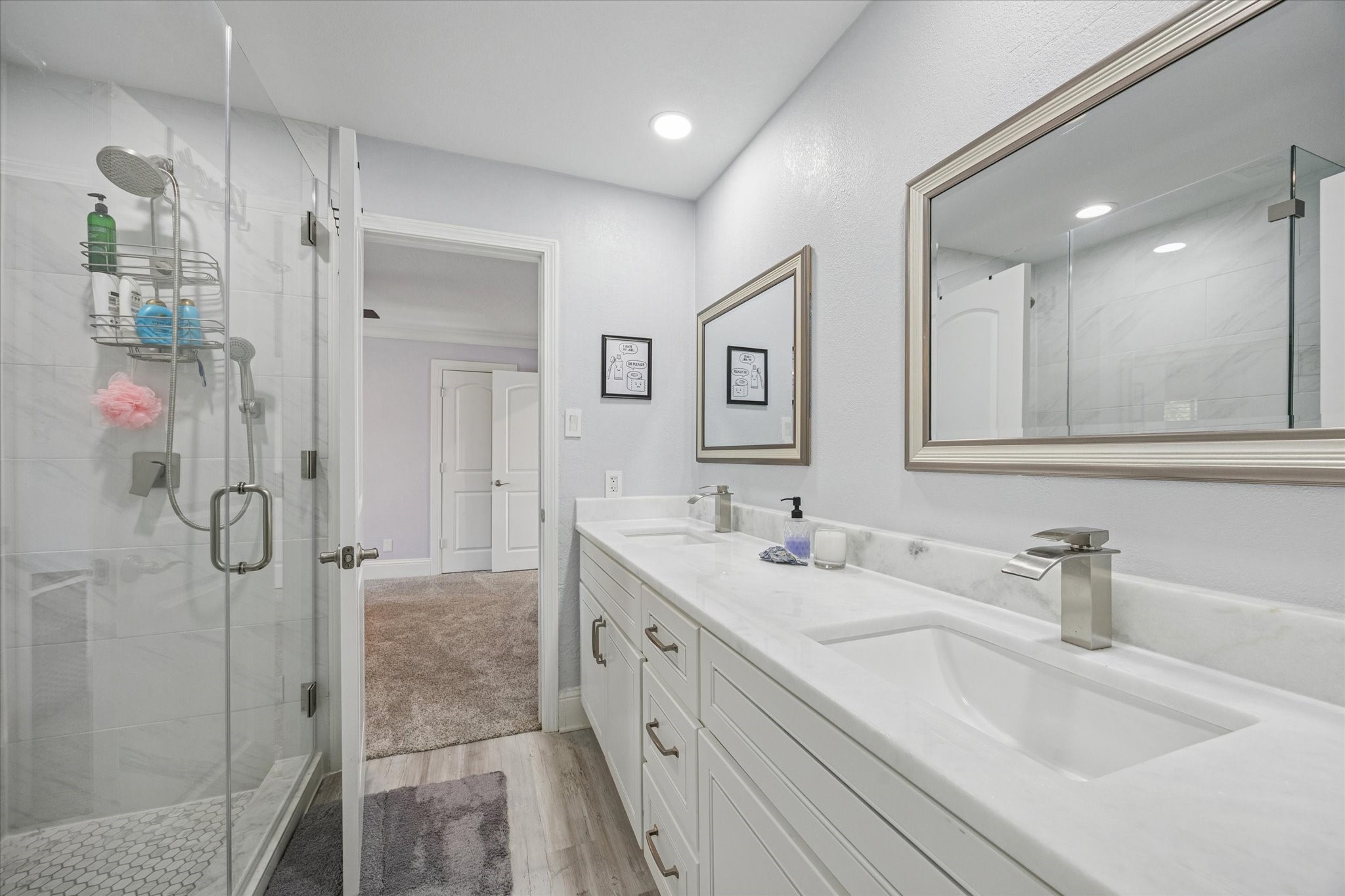 830 Silvergate Drive Houston, TX 77079 - Photo 29 of 38 a bathroom with a double vanity sink mirror and shower