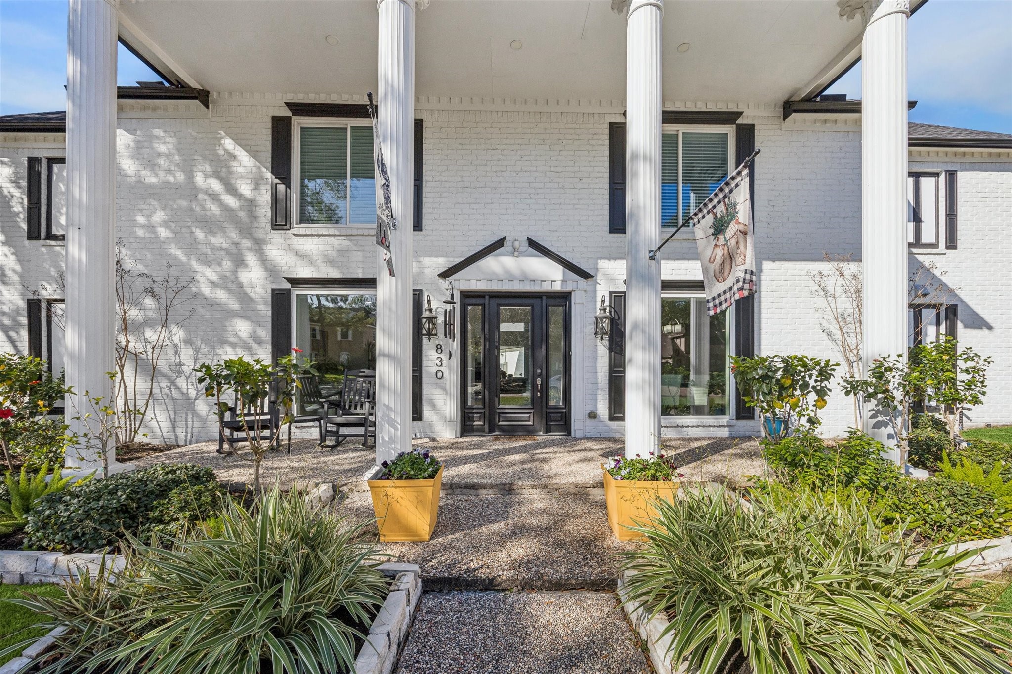 830 Silvergate Drive Houston, TX 77079 - Photo 4 of 38 a front view of a house with yard and outdoor seating