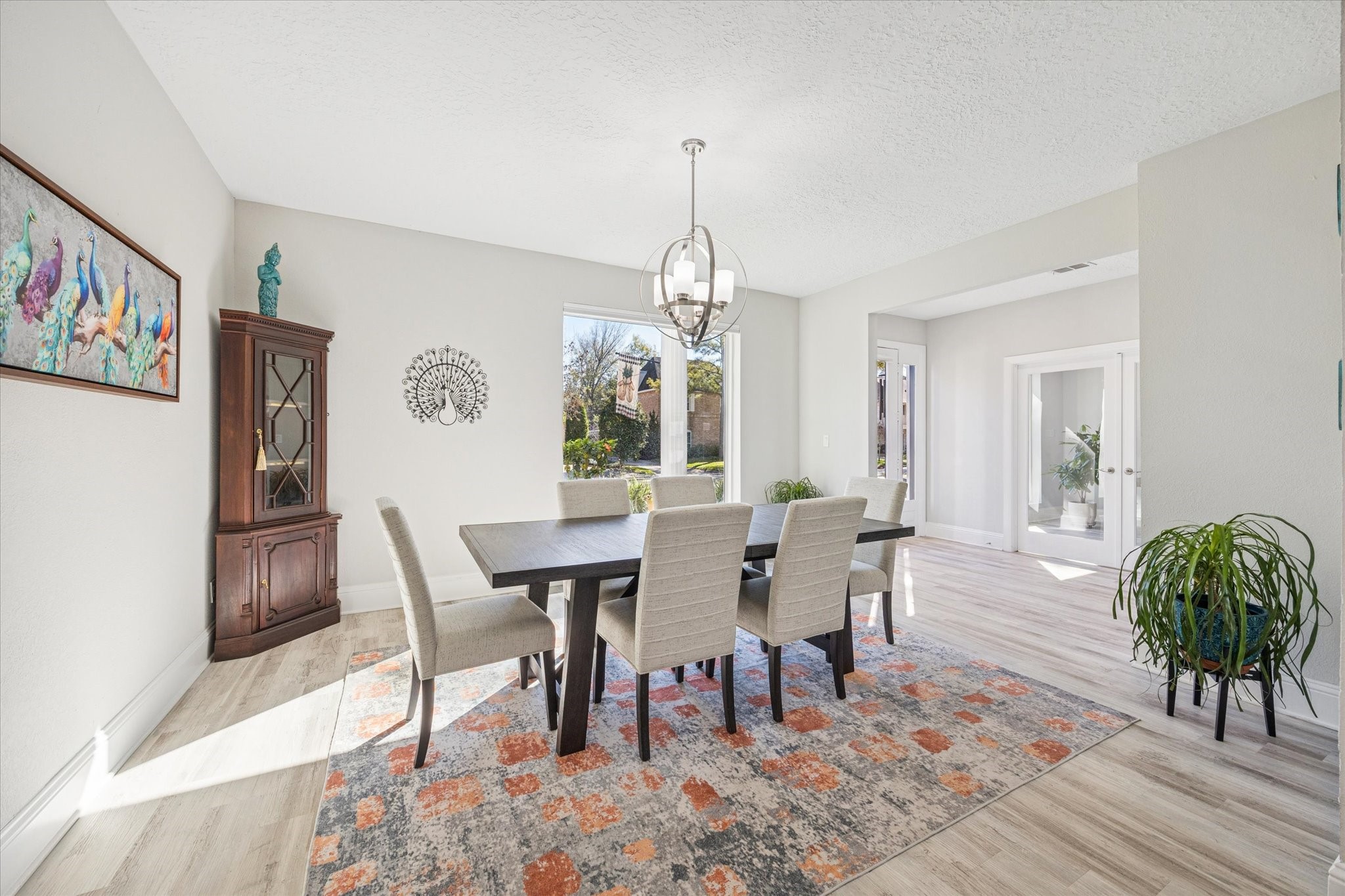 830 Silvergate Drive Houston, TX 77079 - Photo 9 of 38 a view of a dining room with furniture window and wooden floor