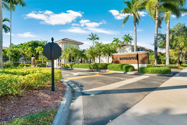 a view of a street with a building in the background