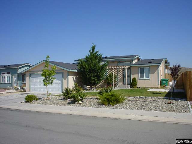 1349 Leopard Street Reno, NV 89506 - Photo 1 of 1 a front view of a house with garden