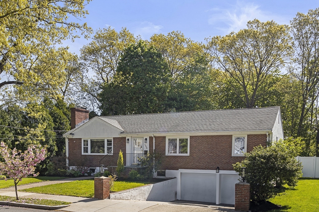156 Woodcliff Road Newton, MA 02461 - Photo 1 of 17 a front view of a house with garden