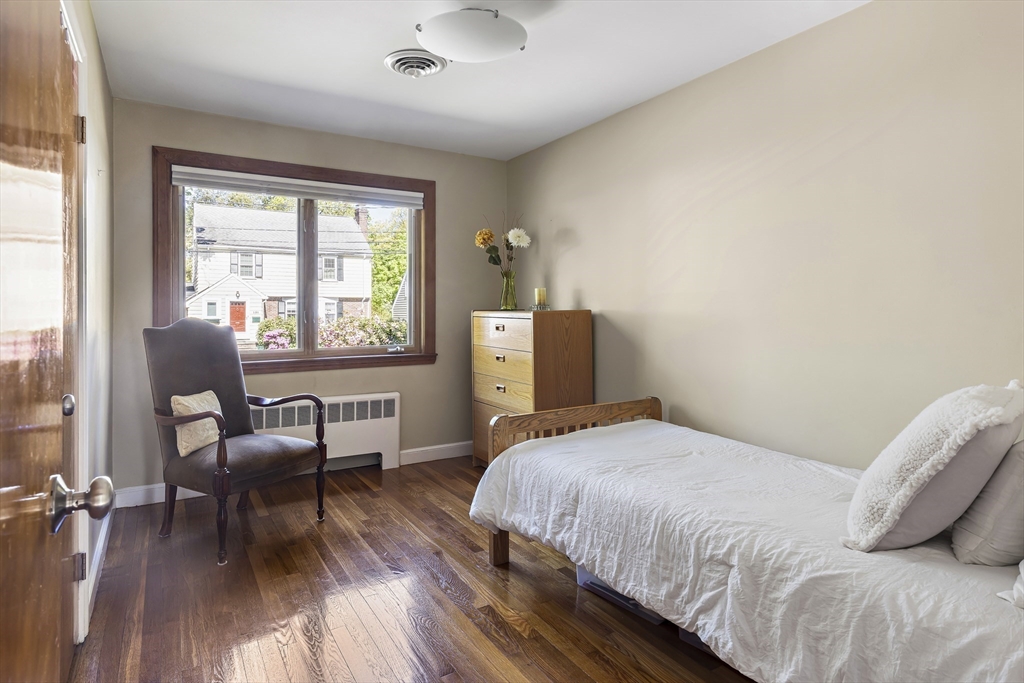 156 Woodcliff Road Newton, MA 02461 - Photo 11 of 17 a bedroom with a bed and wooden floor