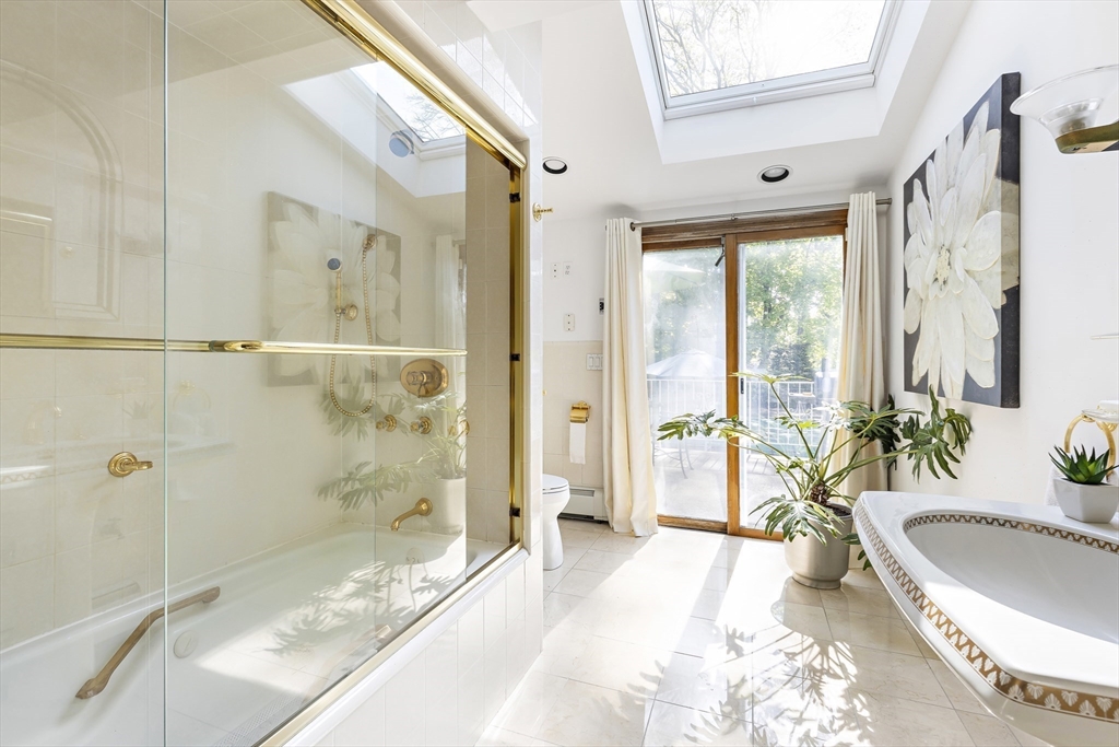 156 Woodcliff Road Newton, MA 02461 - Photo 12 of 17 a spacious bathroom with a granite countertop tub shower and sink